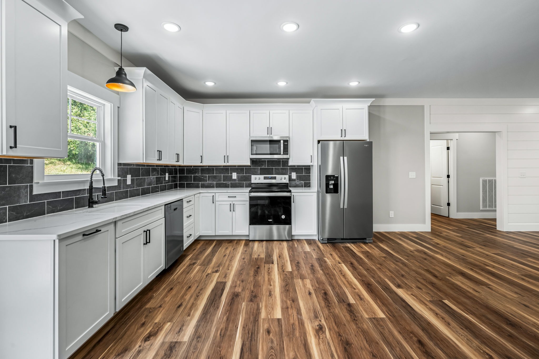 2305 Hurricane Creek Road Lynchburg, TN 37352 - Photo 14 of 54 a large kitchen with cabinets stainless steel appliances and a counter space