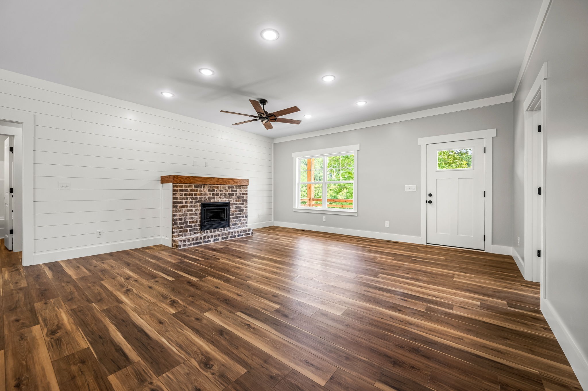 2305 Hurricane Creek Road Lynchburg, TN 37352 - Photo 18 of 54 a view of empty room with wooden floor and fireplace