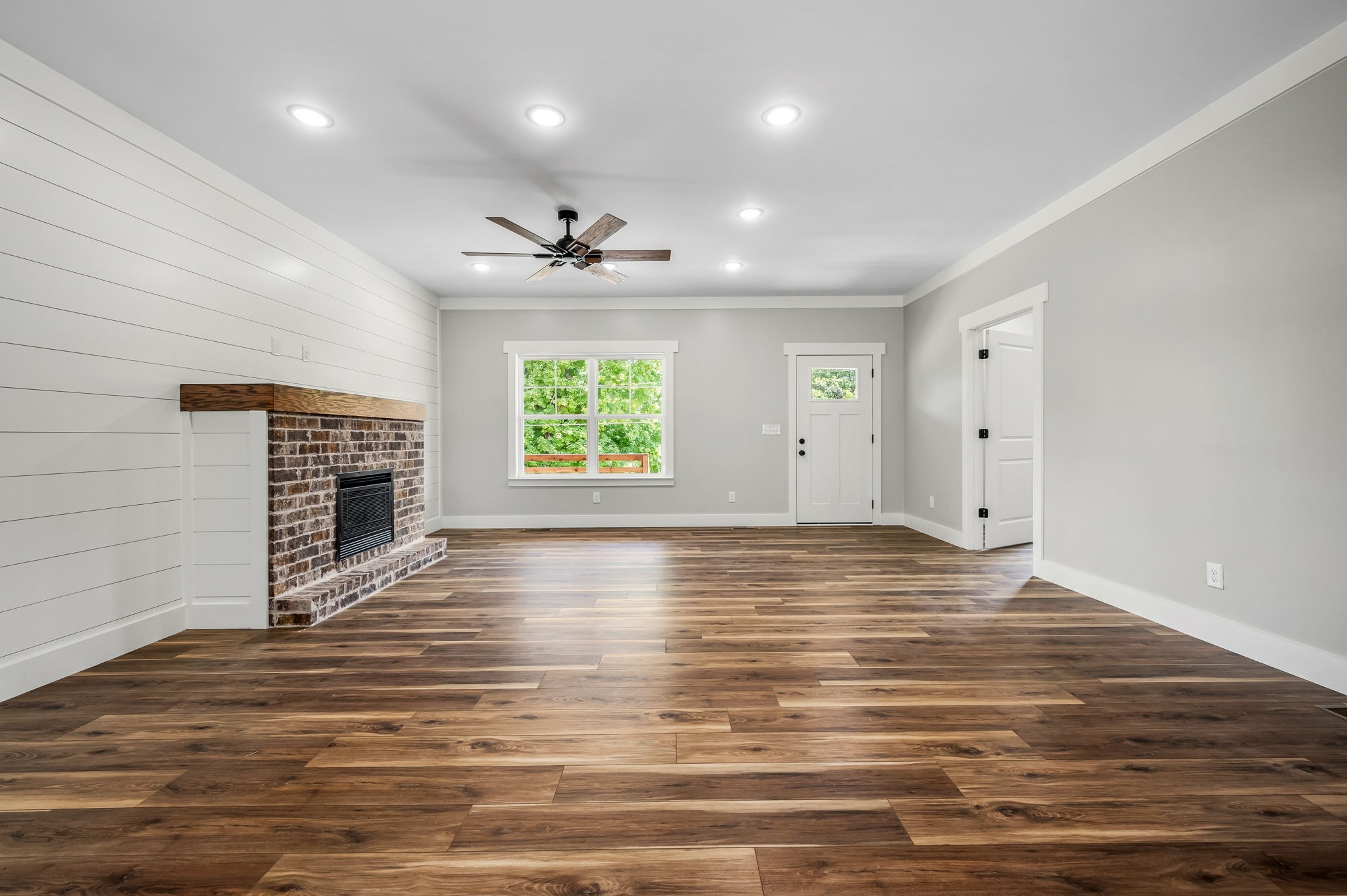 2305 Hurricane Creek Road Lynchburg, TN 37352 - Photo 20 of 54 an empty room with wooden floor and chandelier