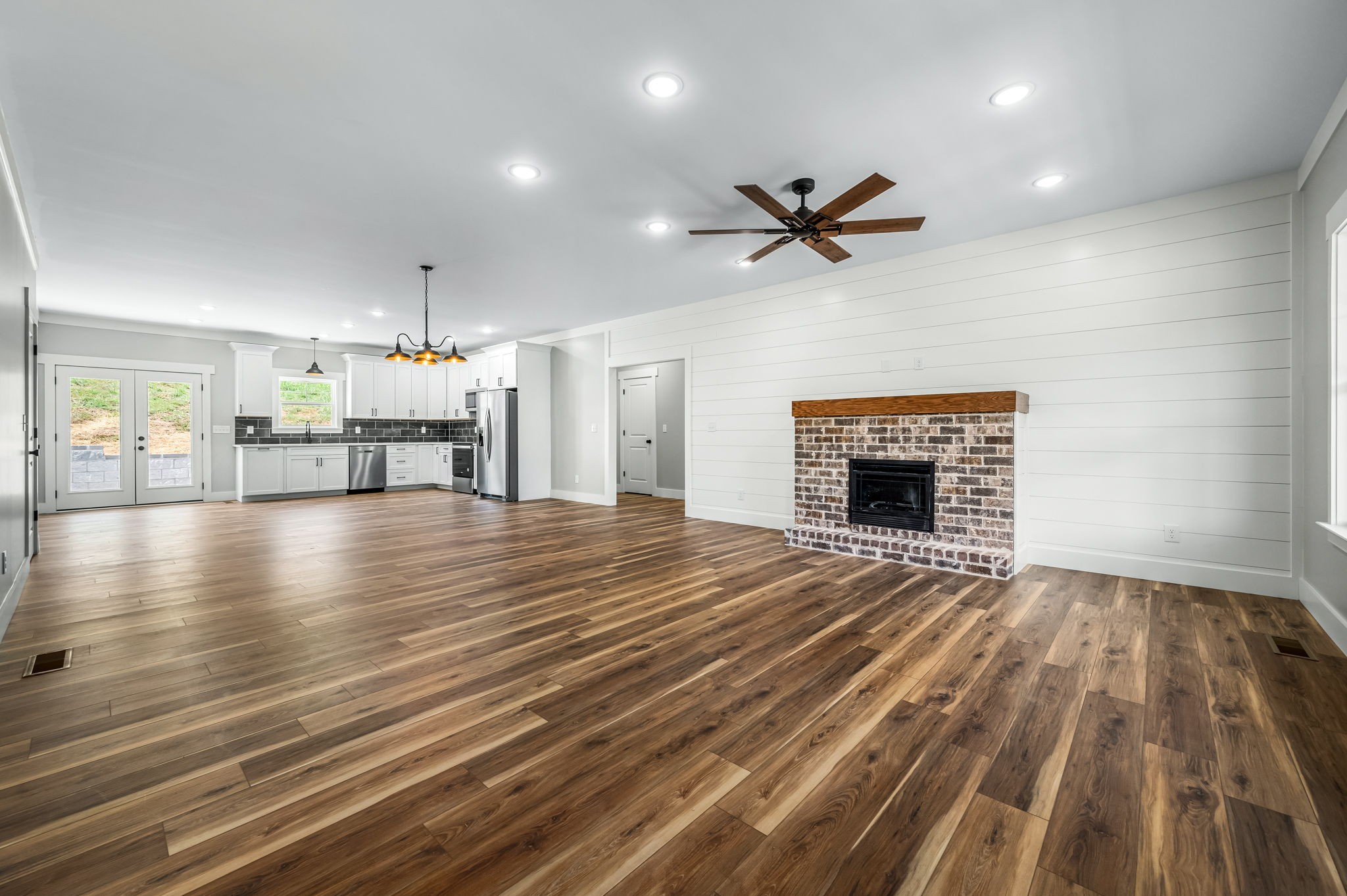2305 Hurricane Creek Road Lynchburg, TN 37352 - Photo 21 of 54 wooden floor in an empty room with a fireplace
