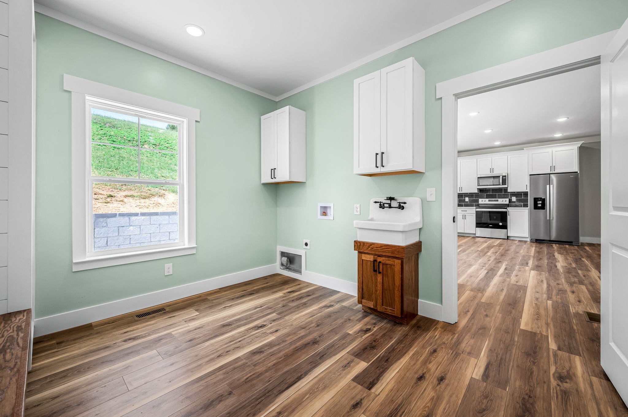 2305 Hurricane Creek Road Lynchburg, TN 37352 - Photo 27 of 54 a view of a kitchen with wooden floor electronic appliances and window