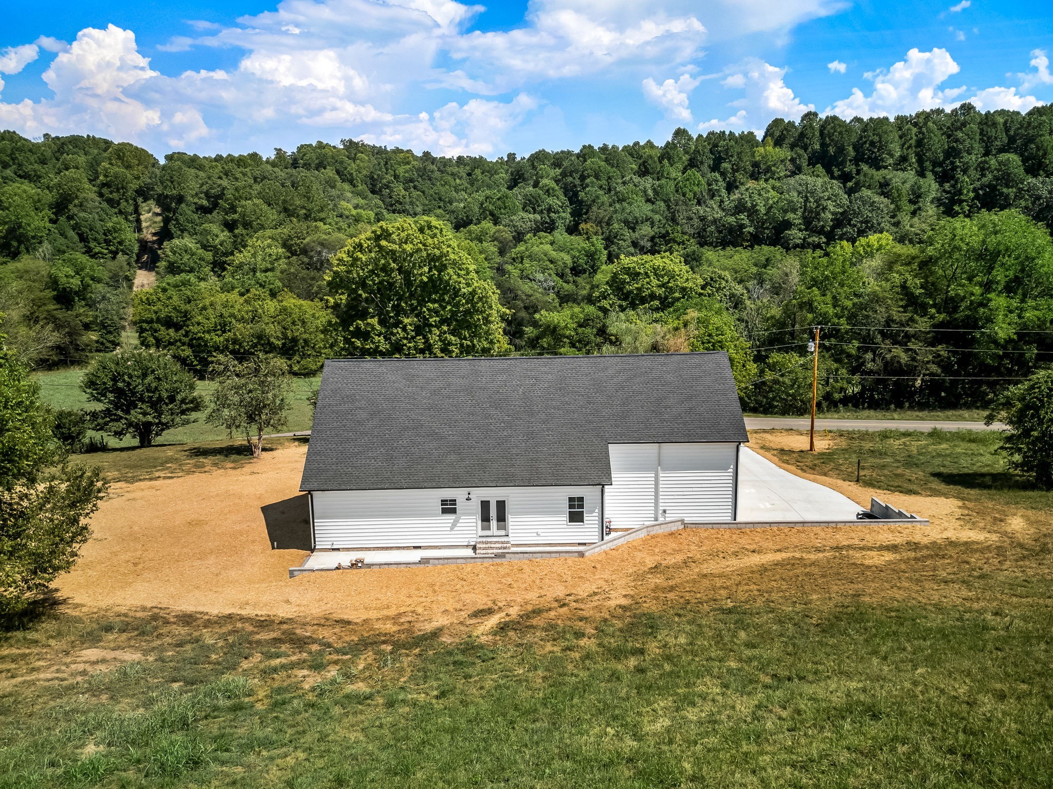 2305 Hurricane Creek Road Lynchburg, TN 37352 - Photo 46 of 54 a view of house with swimming pool and mountains in the background