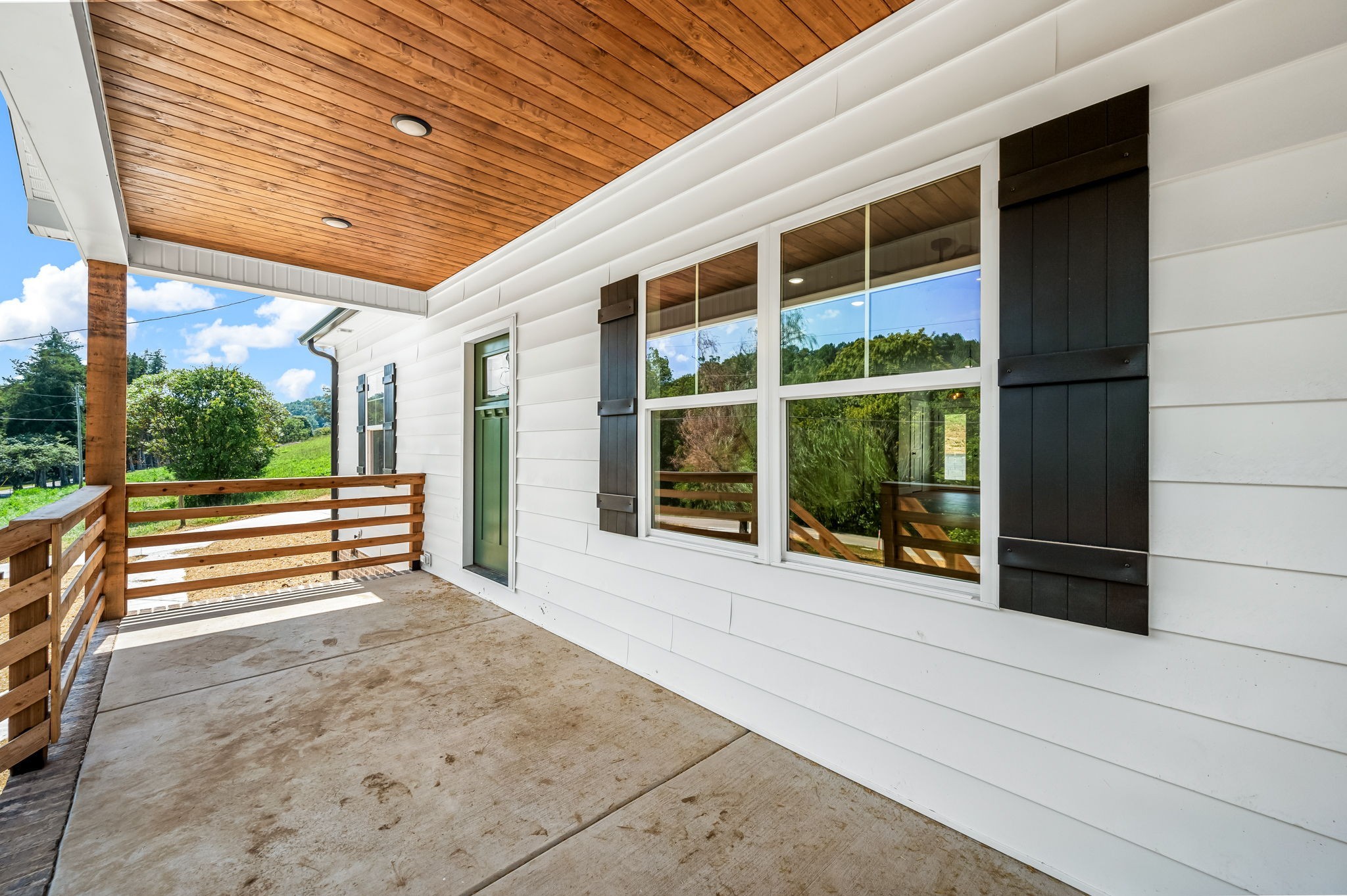 2305 Hurricane Creek Road Lynchburg, TN 37352 - Photo 50 of 54 a view of a porch with wooden floor and fence