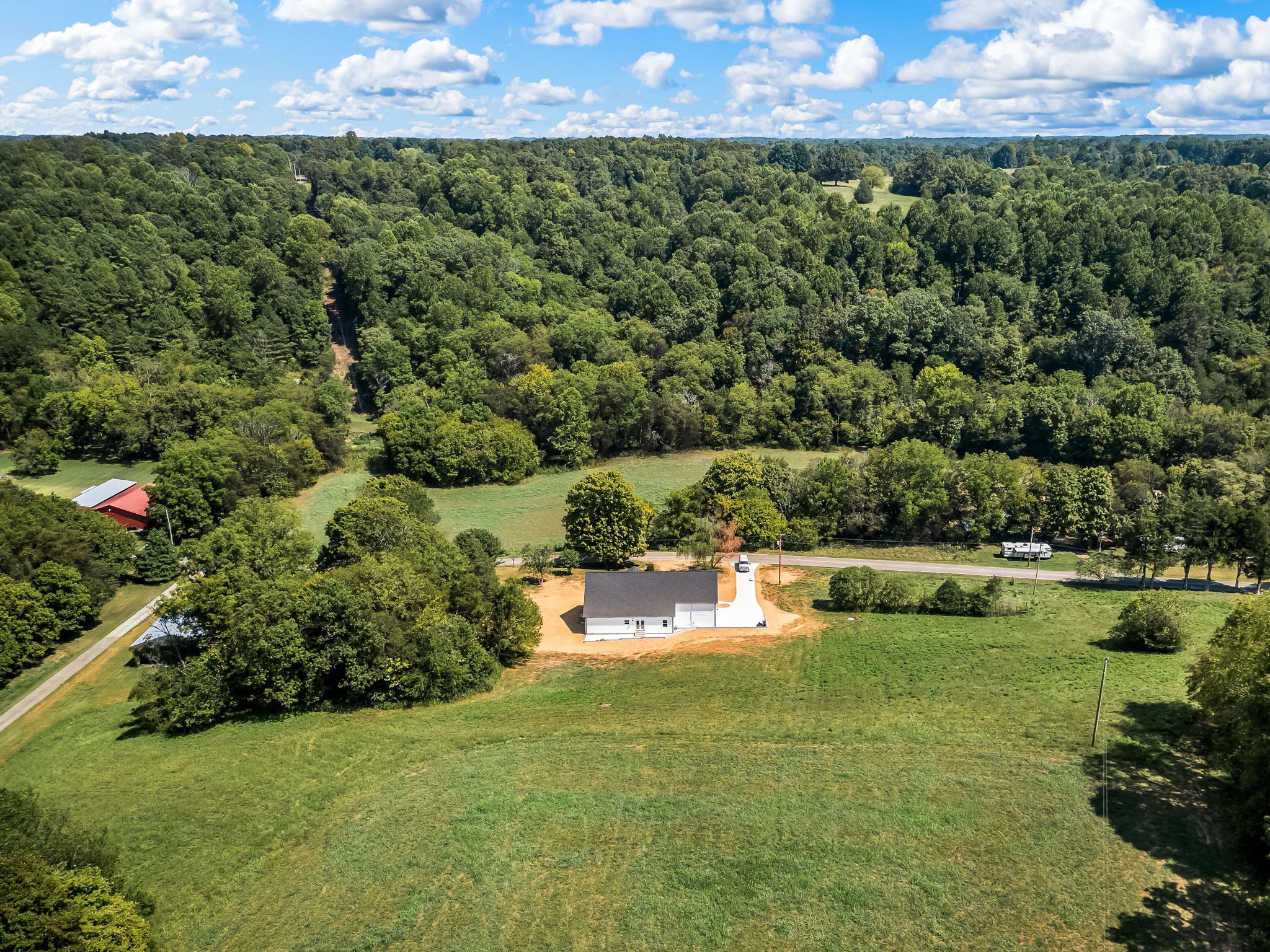 2305 Hurricane Creek Road Lynchburg, TN 37352 - Photo 51 of 54 a view of a lake with a city