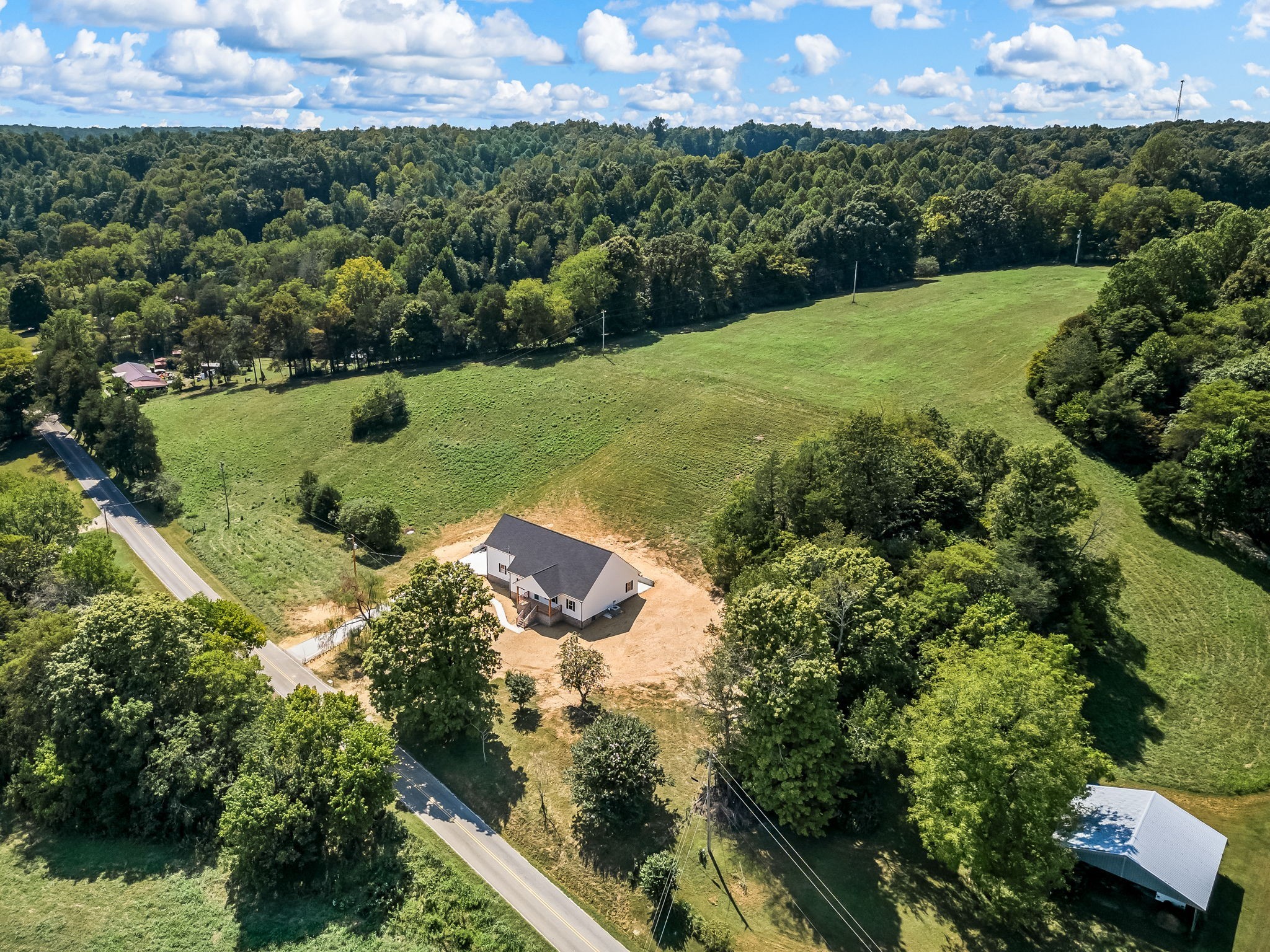 2305 Hurricane Creek Road Lynchburg, TN 37352 - Photo 54 of 54 an aerial view of a house with a yard