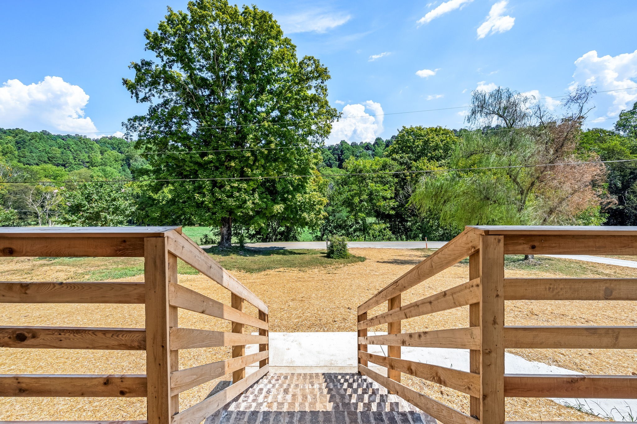 2305 Hurricane Creek Road Lynchburg, TN 37352 - Photo 8 of 54 a view of balcony with wooden floor and outdoor seating