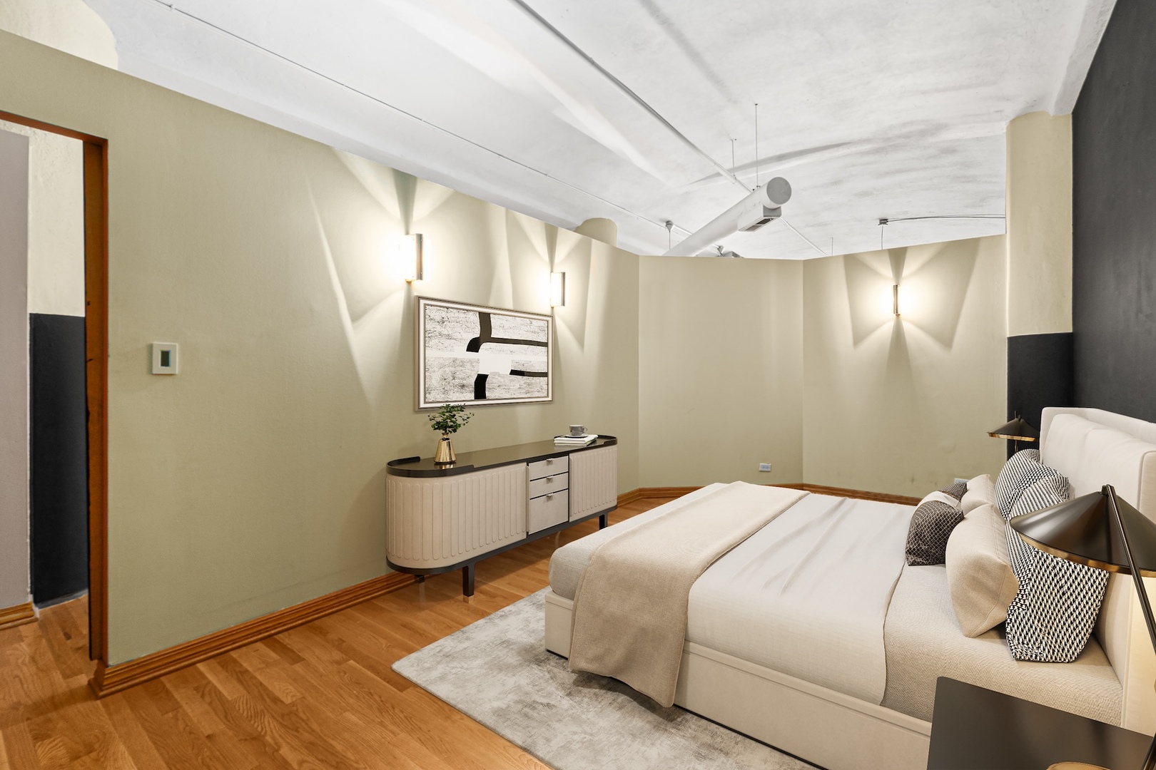 801 South Wells Street, Unit 503 Chicago, IL 60607 - Photo 7 of 21 a bedroom with a bed and a chandelier