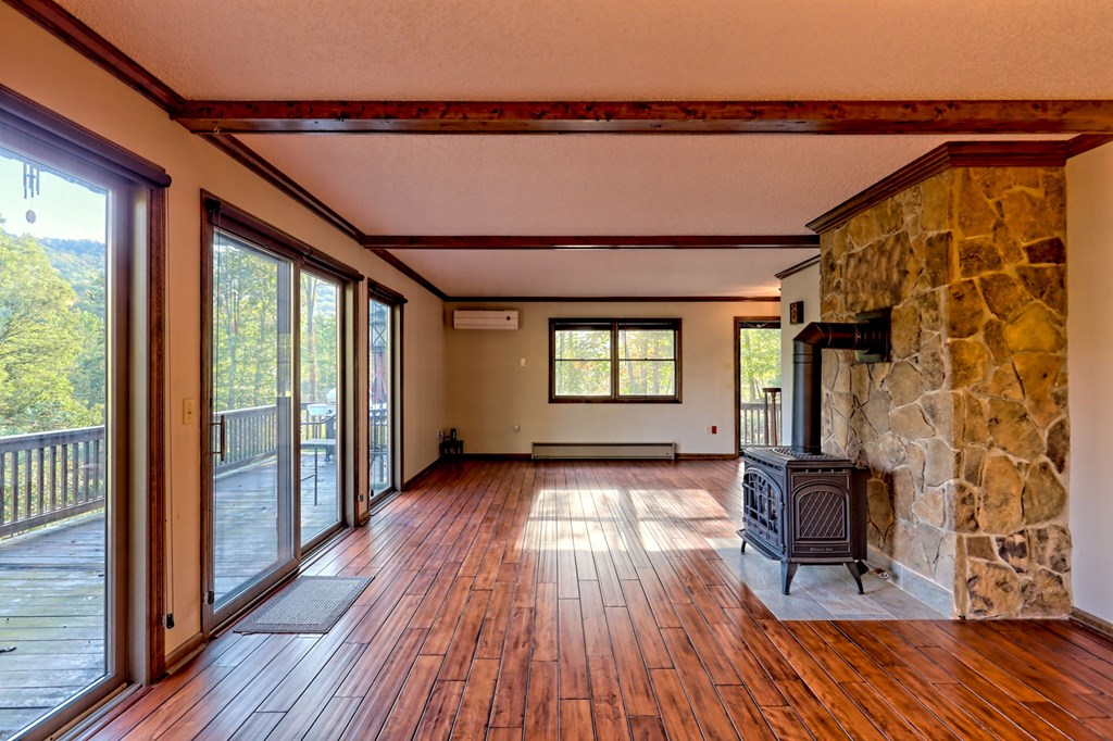 206 Peckerwood Road Hayesville, NC 28904 - Photo 13 of 73 a view of hallway with wooden floor and furniture