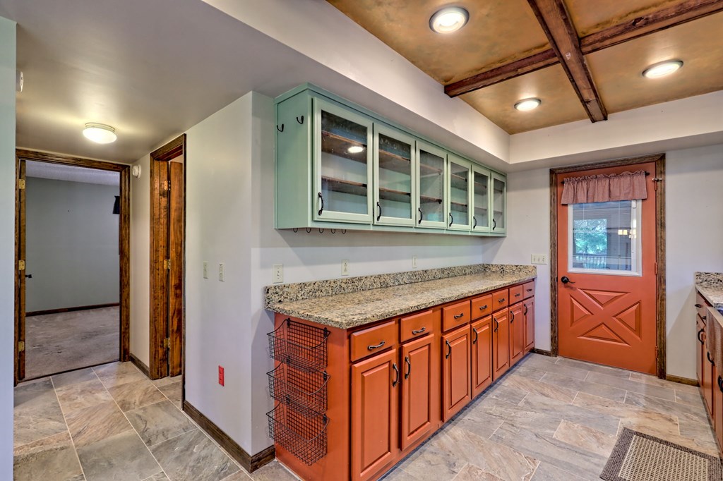 206 Peckerwood Road Hayesville, NC 28904 - Photo 20 of 73 a kitchen with stainless steel appliances granite countertop a stove and cabinets