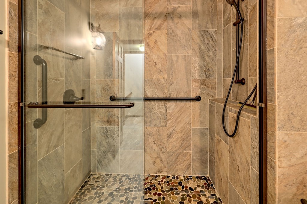 206 Peckerwood Road Hayesville, NC 28904 - Photo 22 of 73 a bathroom with a glass shower door
