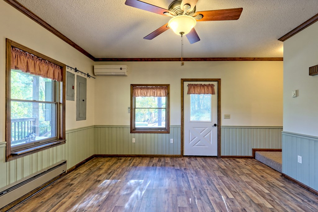 206 Peckerwood Road Hayesville, NC 28904 - Photo 41 of 73 wooden floor in an empty room with a window