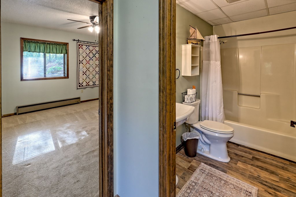 206 Peckerwood Road Hayesville, NC 28904 - Photo 45 of 73 a bathroom with a toilet and a shower