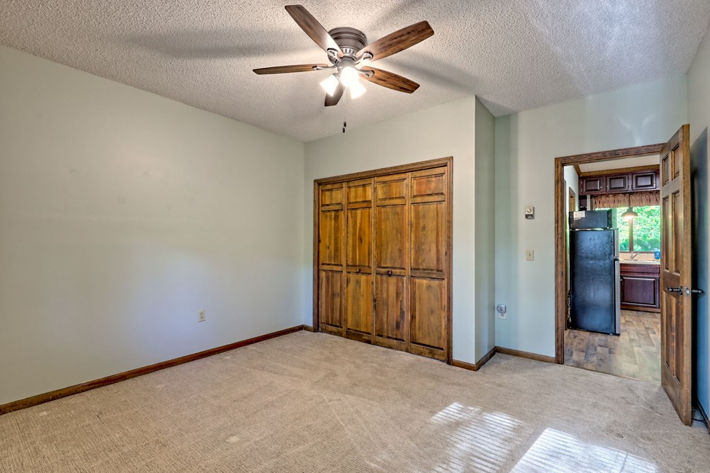 206 Peckerwood Road Hayesville, NC 28904 - Photo 47 of 73 a view of a livingroom with a ceiling fan and a window