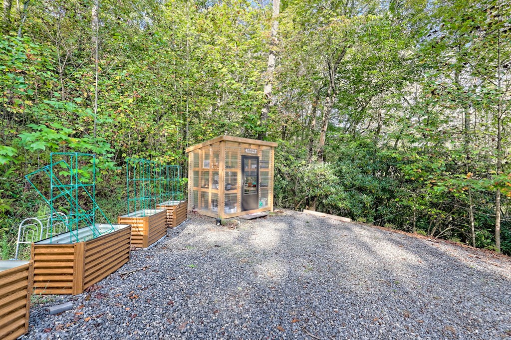 206 Peckerwood Road Hayesville, NC 28904 - Photo 59 of 73 a view of a large yard with plants and wooden fence