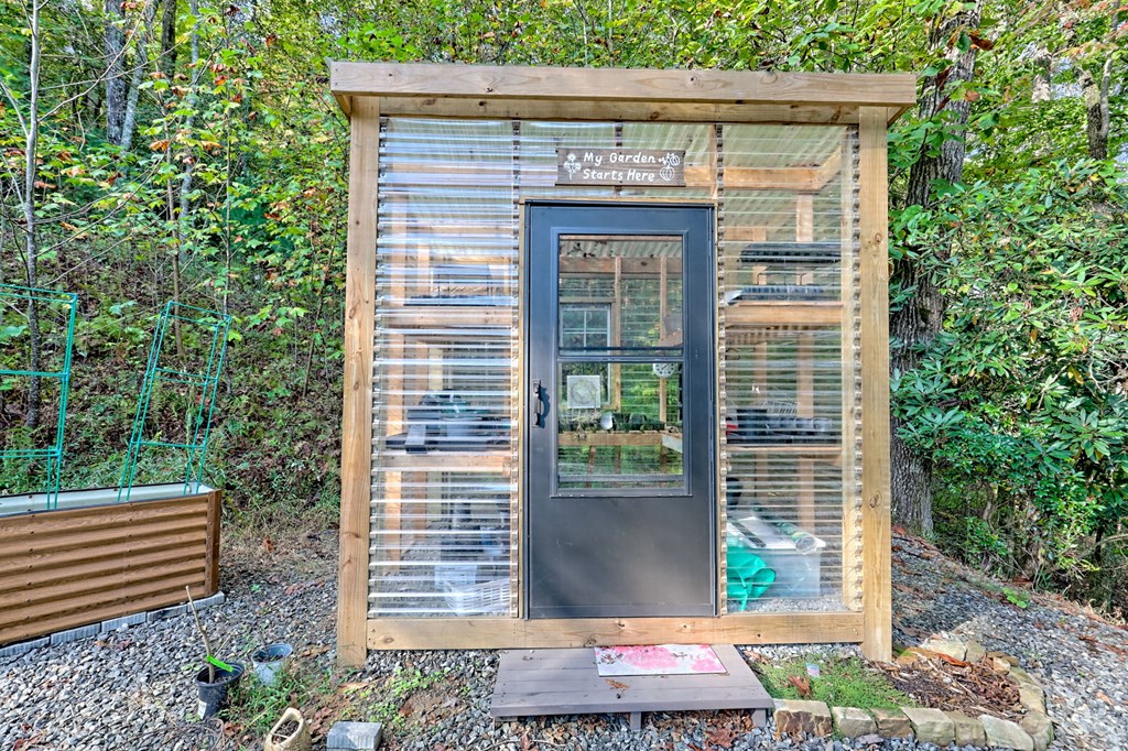 206 Peckerwood Road Hayesville, NC 28904 - Photo 60 of 73 a front view of a house with garden