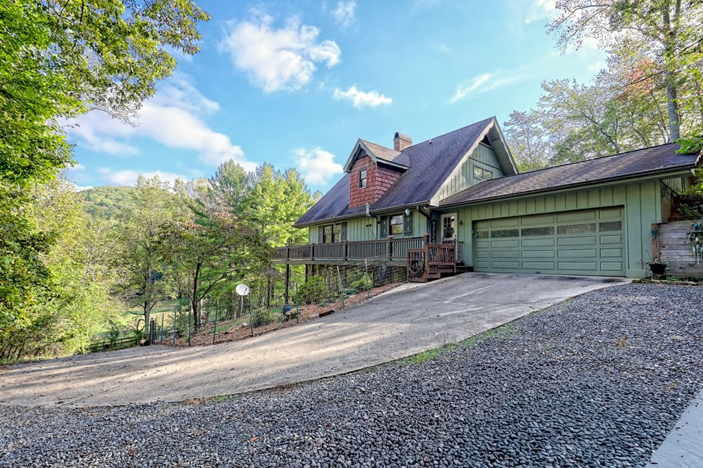 206 Peckerwood Road Hayesville, NC 28904 - Photo 64 of 73 a front view of a house with a yard and trees