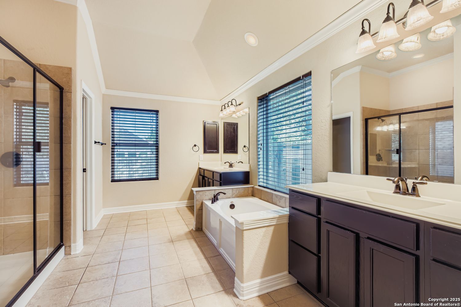17820 Oxford Mount Helotes, TX 78023 - Photo 17 of 26 a bathroom with a tub sink and mirror