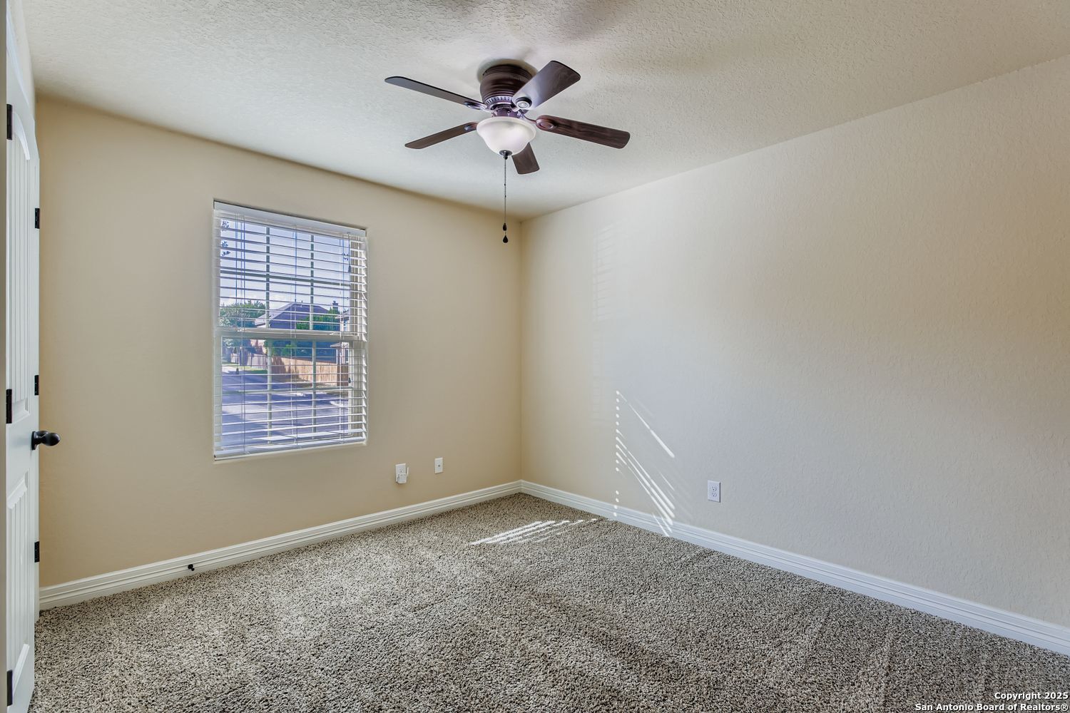 17820 Oxford Mount Helotes, TX 78023 - Photo 19 of 26 a view of an empty room with a window