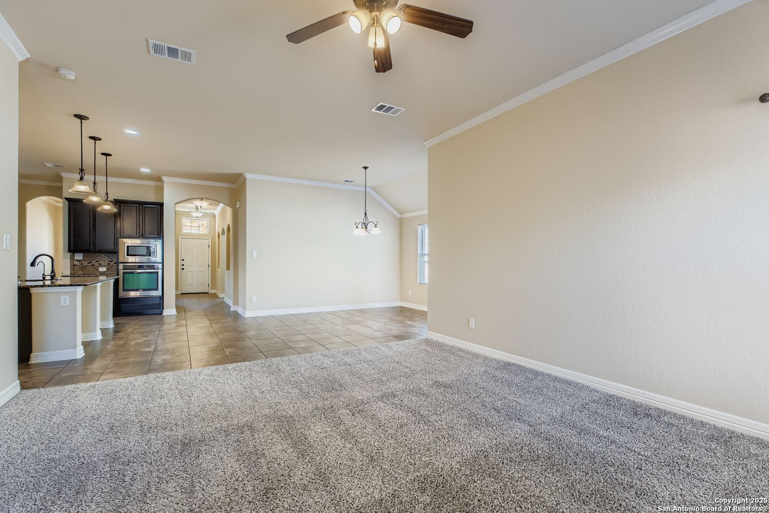 17820 Oxford Mount Helotes, TX 78023 - Photo 5 of 26 a view of a kitchen with a sink and a refrigerator