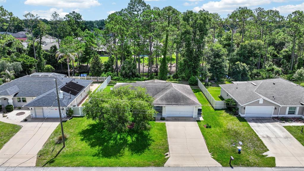 80 Roxboro Drive Palm Coast, FL 32164 - Photo 34 of 39 an aerial view of a house with garden