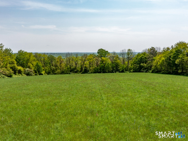 215 B Melius Road Warren, CT 06754 - Photo 3 of 7 a view of a field with an ocean
