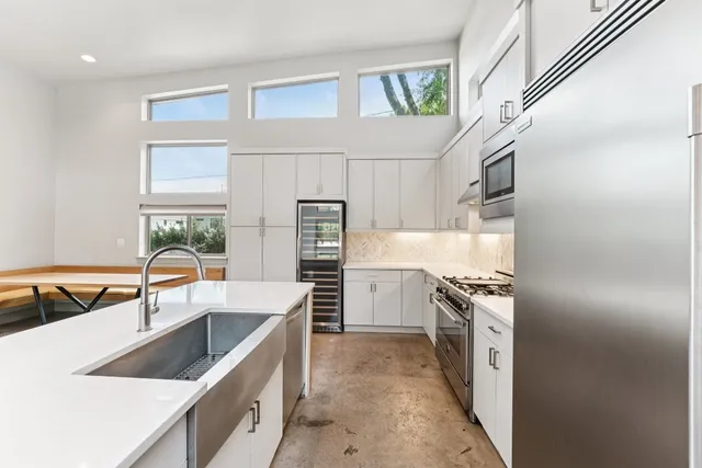a kitchen with a sink and a window