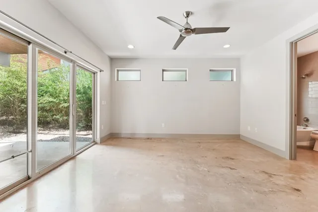 a kitchen with granite countertop a sink and a stove top oven