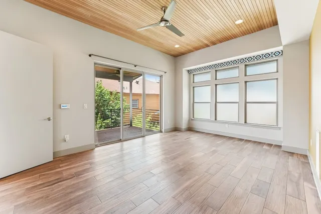 a view of hallway with wooden floor