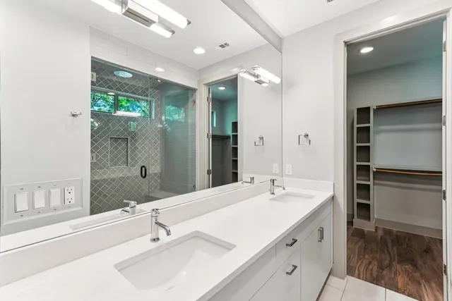 a bathroom with a sink and mirror
