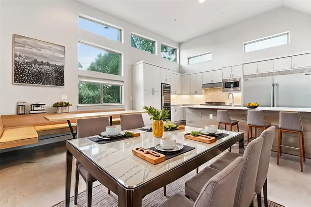 a kitchen with a table and chairs in it