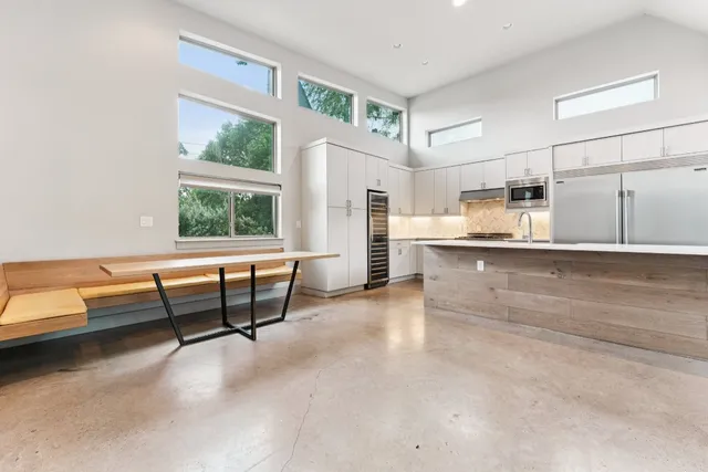 a view of kitchen with furniture and windows