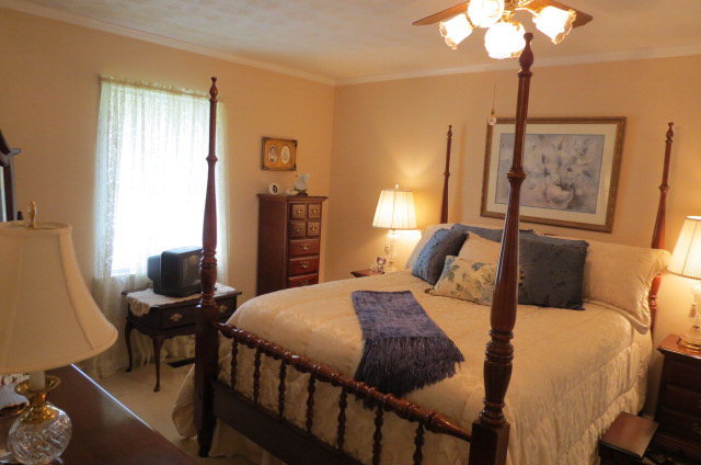 1479 Girl Scout Road Lizella, GA 31052 - Photo 14 of 25 a bedroom with a bed and furniture