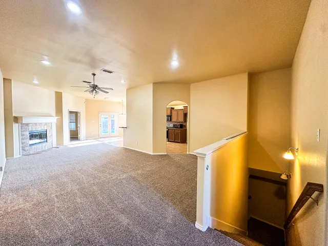 a view of a kitchen with a sink and a refrigerator
