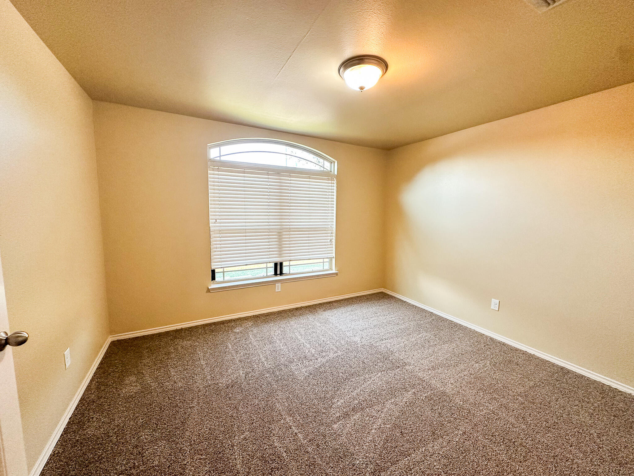2309 101st Street Lubbock, TX 79423 - Photo 13 of 36 an empty room with a empty space and windows