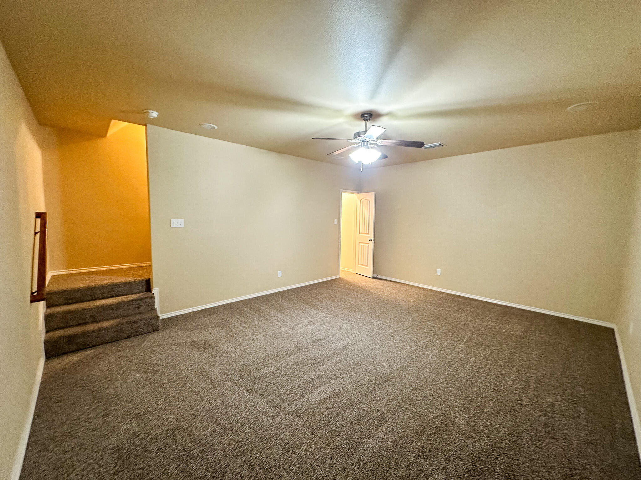 2309 101st Street Lubbock, TX 79423 - Photo 17 of 36 an empty room with a empty space and a ceiling fan
