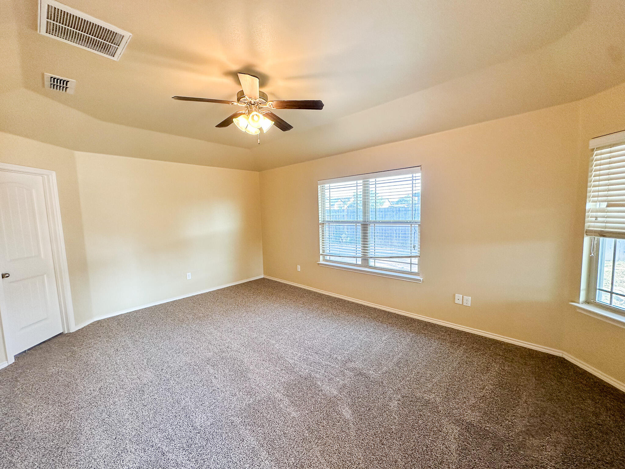 2309 101st Street Lubbock, TX 79423 - Photo 30 of 36 a view of an empty room with a window