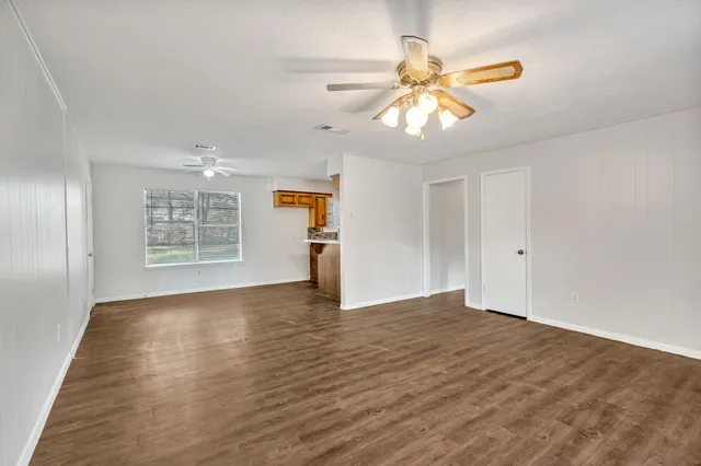 a kitchen with granite countertop a sink and a window