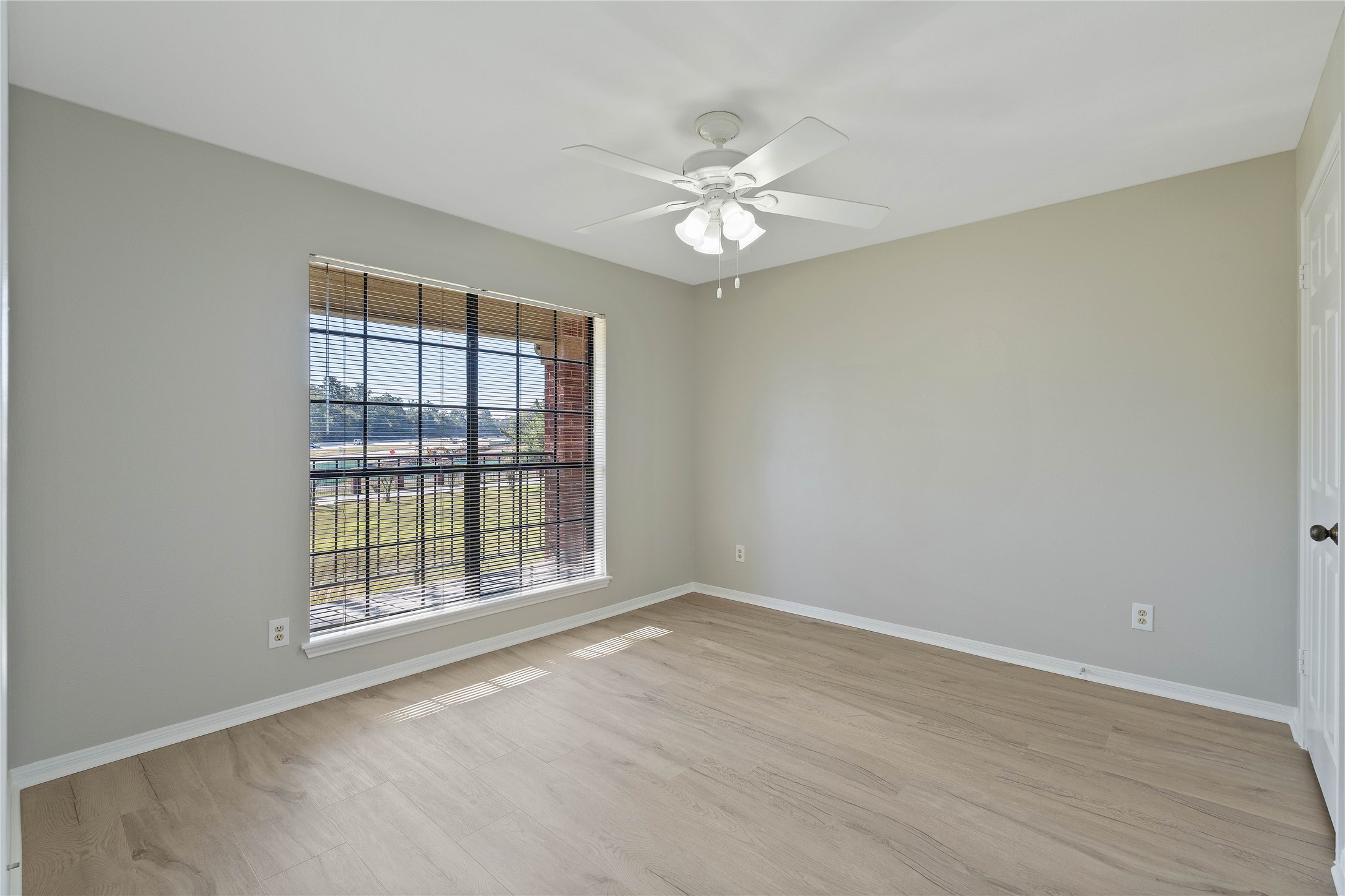 200 Panorama Drive, Unit 107 Conroe, TX 77304 - Photo 16 of 32 a view of an empty room with a window