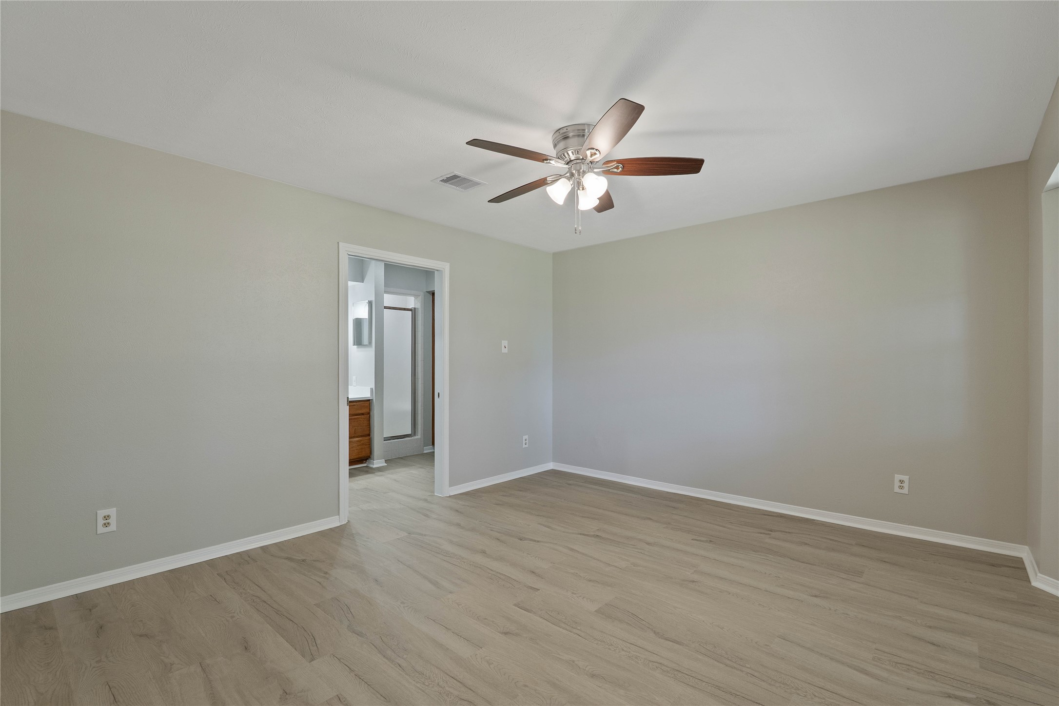 200 Panorama Drive, Unit 107 Conroe, TX 77304 - Photo 19 of 32 a view of an empty room with wooden floor