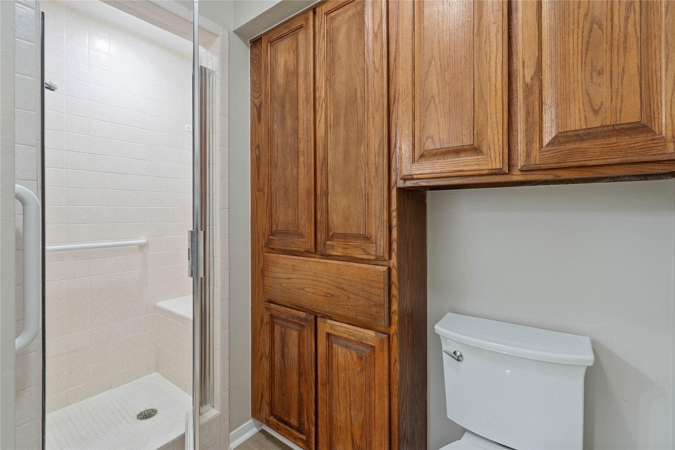 200 Panorama Drive, Unit 107 Conroe, TX 77304 - Photo 24 of 32 a bathroom with a shower and a toilet