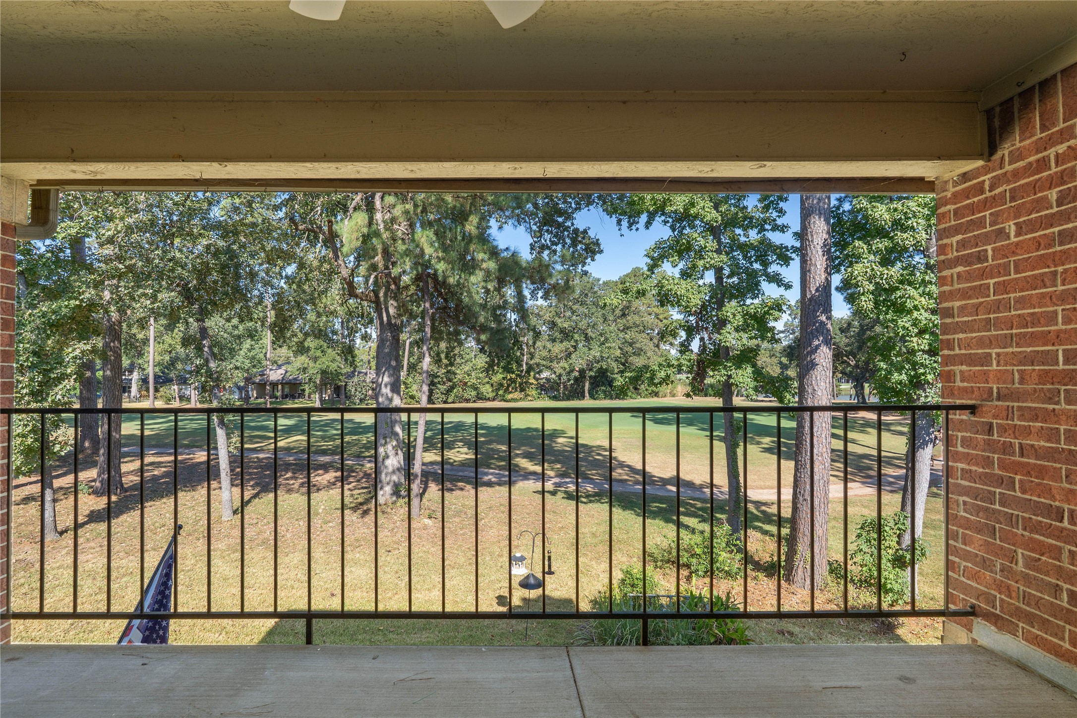 200 Panorama Drive, Unit 107 Conroe, TX 77304 - Photo 30 of 32 a view of a lake from a window