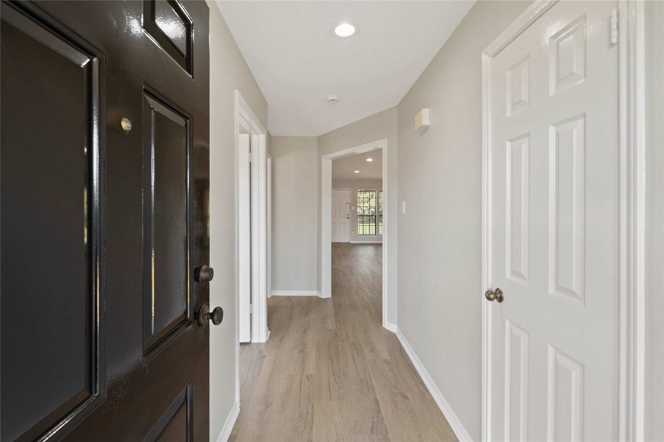 200 Panorama Drive, Unit 107 Conroe, TX 77304 - Photo 3 of 32 a view of a hallway with wooden floor