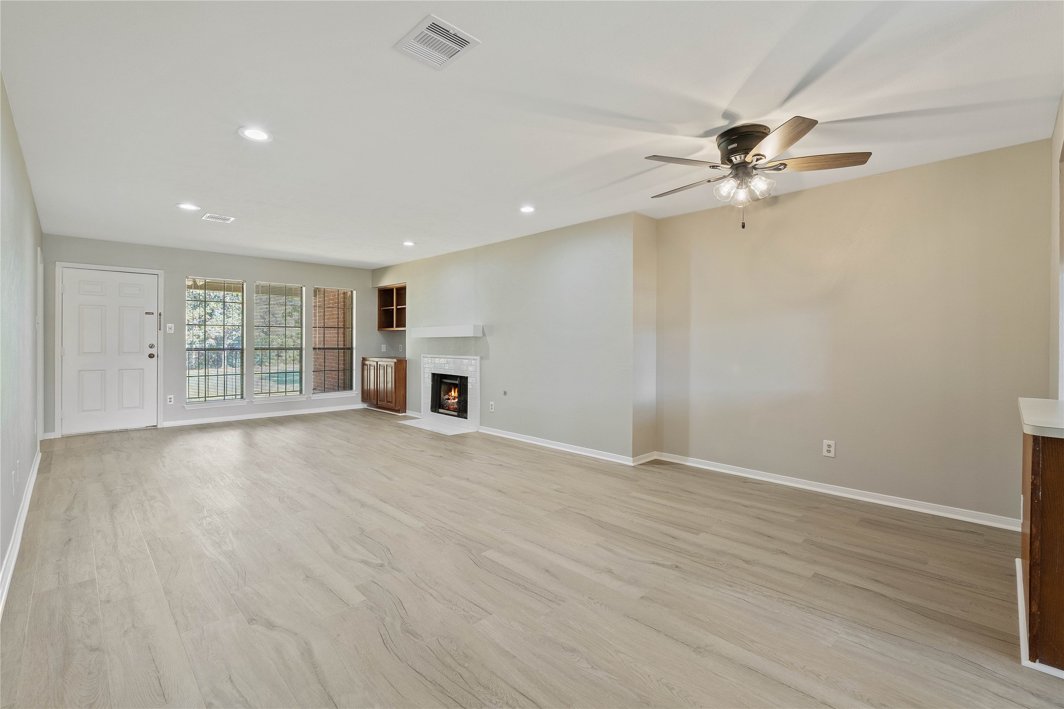 200 Panorama Drive, Unit 107 Conroe, TX 77304 - Photo 4 of 32 a view of an empty room with a window
