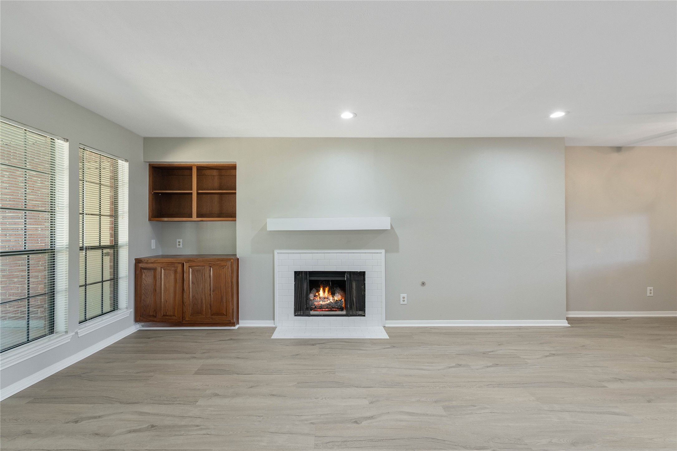 200 Panorama Drive, Unit 107 Conroe, TX 77304 - Photo 7 of 32 a view of an empty room with a fireplace and a window
