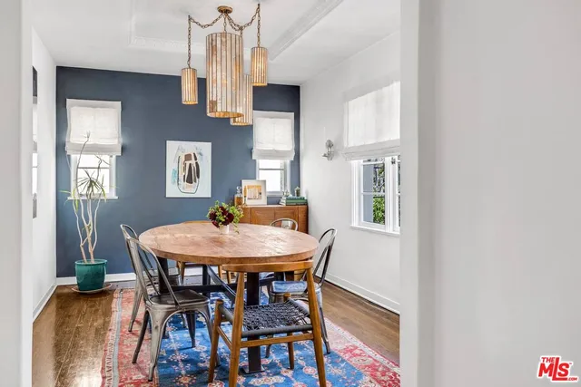 a view of a dining room with furniture and window