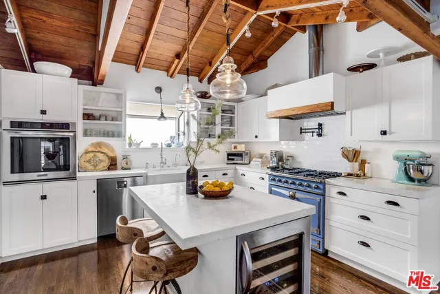a kitchen with a white cabinets and white appliances