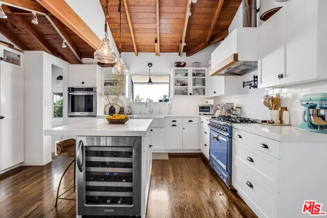 a view of livingroom with furniture and next to a window