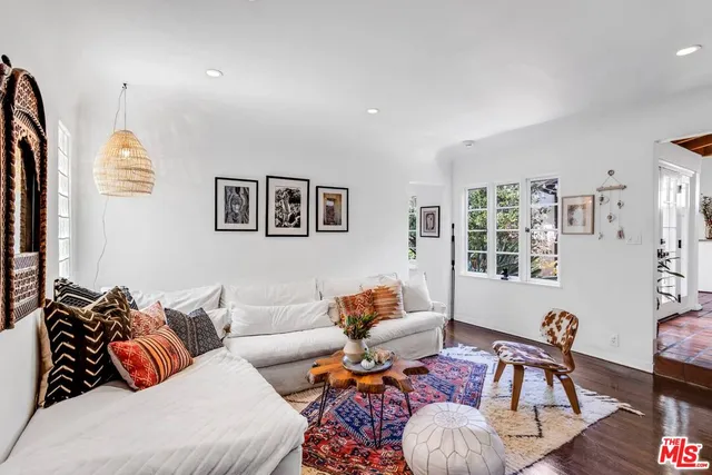 a bathroom with a sink a mirror and a window