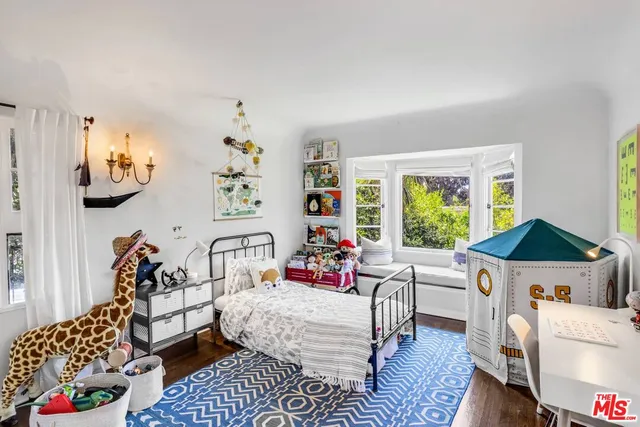 a bedroom with furniture and a bed