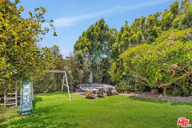 a view of a house with balcony and garden
